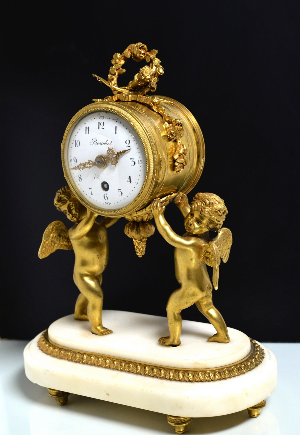 French Empire Gilt Bronze Desk Clock with Cupids and Garland n Marble base