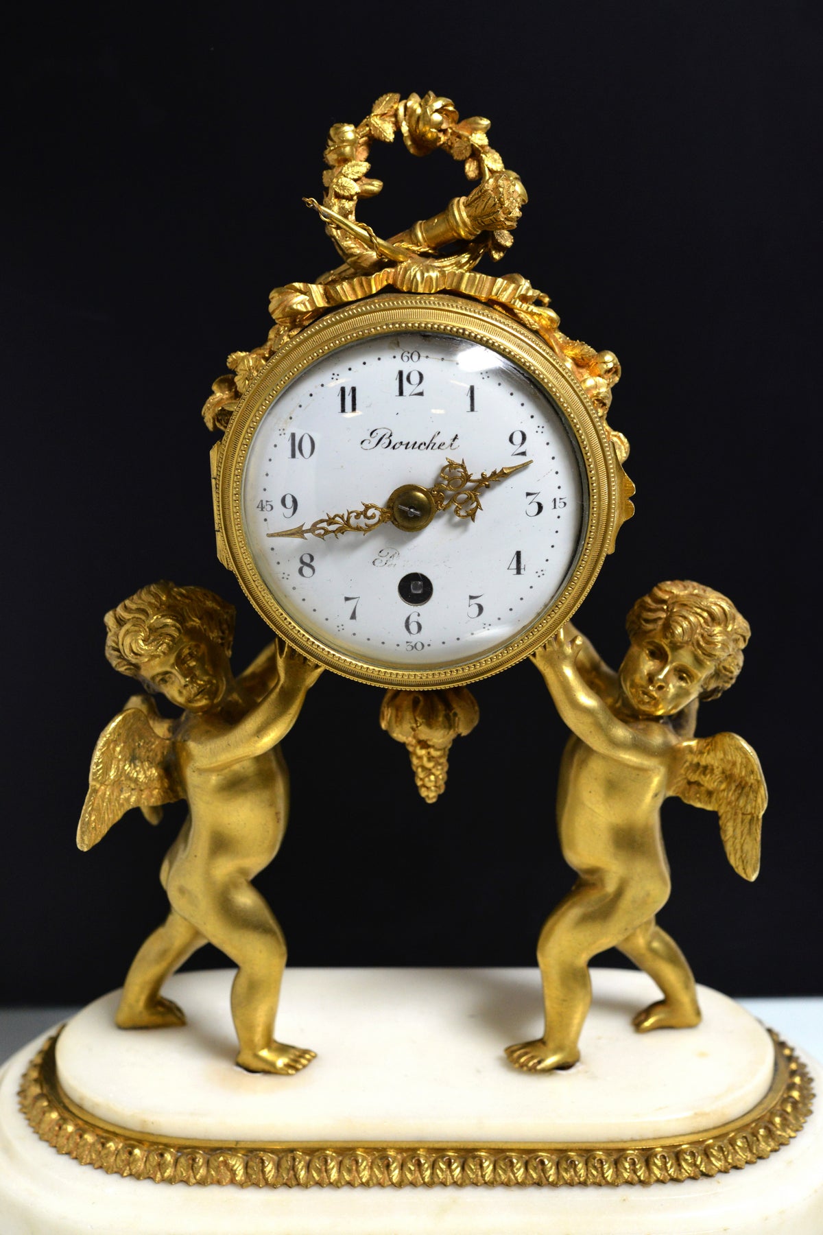 French Empire Gilt Bronze Desk Clock with Cupids and Garland n Marble base