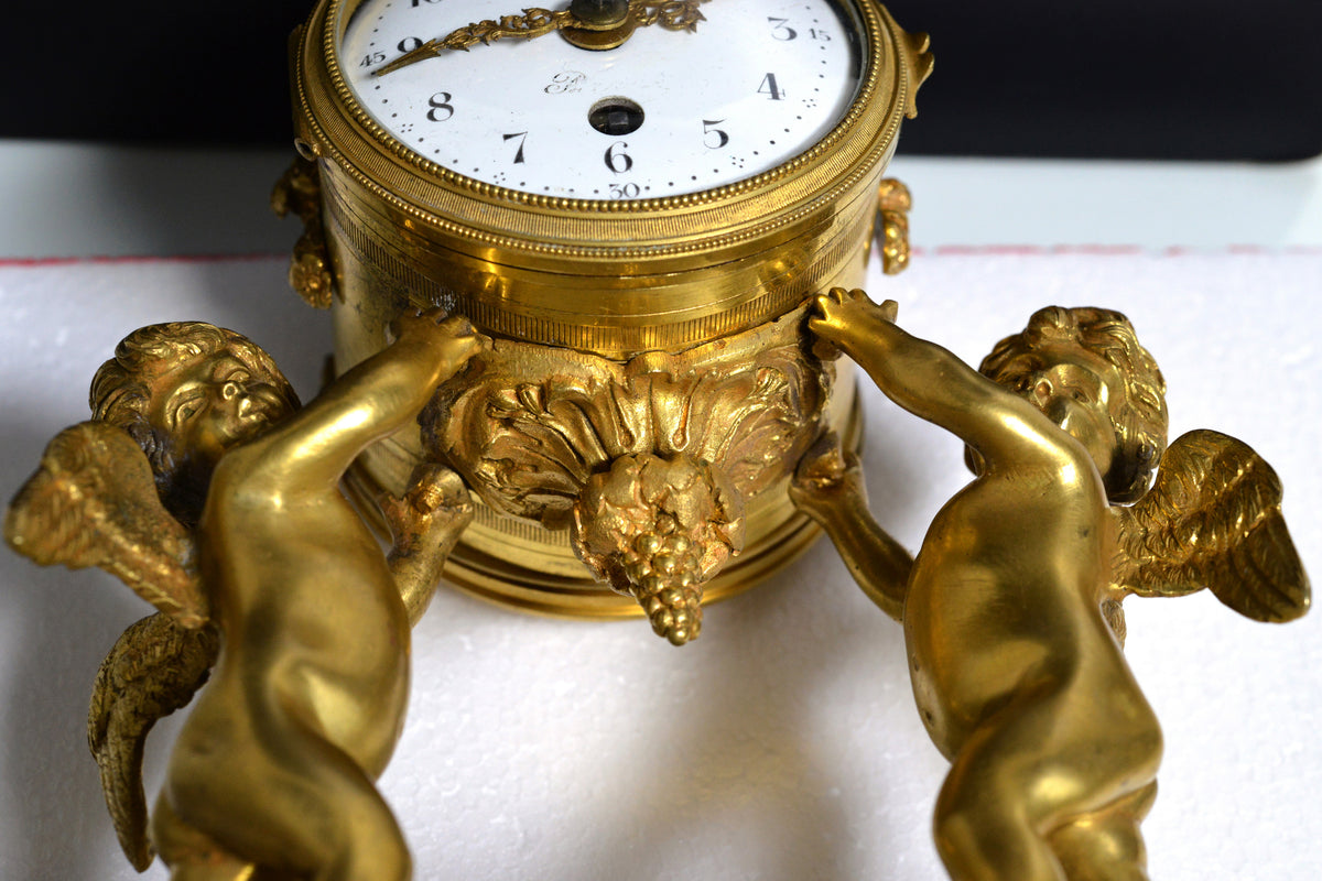 French Empire Gilt Bronze Desk Clock with Cupids and Garland n Marble base